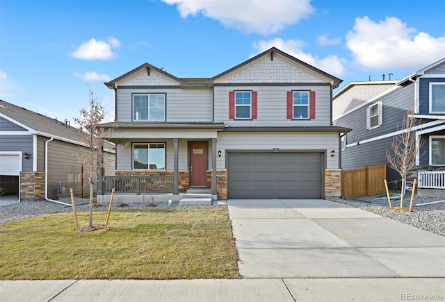 craftsman inspired home featuring a garage, a front yard, and a porch