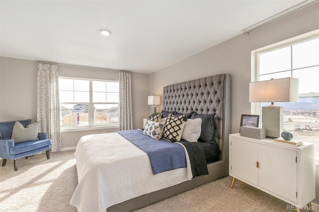 bedroom featuring light carpet