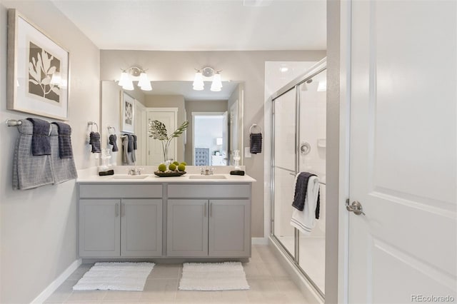 bathroom featuring vanity, tile patterned floors, and walk in shower