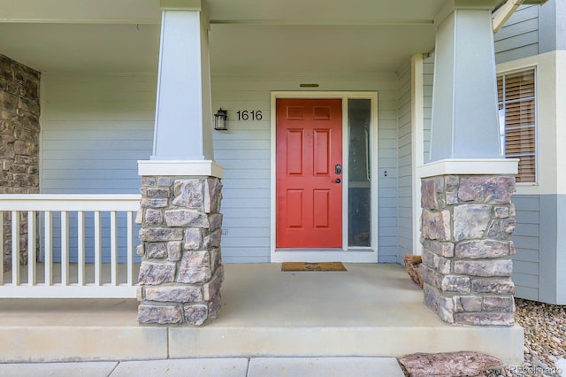 1616 Cedarwood Dr, Longmont, CO 80504 - entrance to property featuring a porch and stone siding