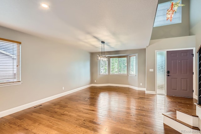 1616 Cedarwood Dr, Longmont, CO 80504 - entrance foyer with a chandelier and light wood-type flooring