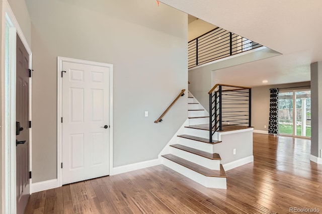 1616 Cedarwood Dr, Longmont, CO 80504 - stairway featuring wood finished floors and a high ceiling