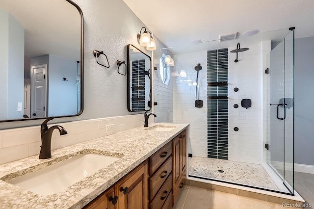 1616 Cedarwood Dr, Longmont, CO 80504 - full bath featuring a shower stall, tile patterned flooring, and double vanity