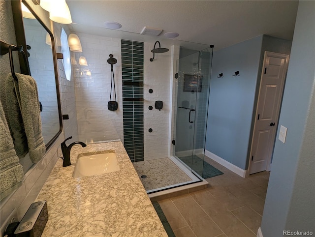 1616 Cedarwood Dr, Longmont, CO 80504 - full bath featuring a shower stall, vanity, and tile patterned floors