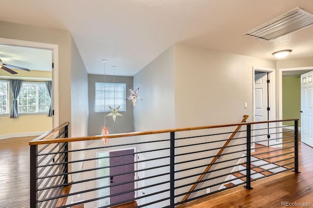 1616 Cedarwood Dr, Longmont, CO 80504 - hallway featuring an upstairs landing, attic access, and hardwood / wood-style flooring
