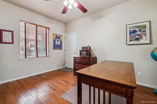 office space featuring ceiling fan and wood-type flooring