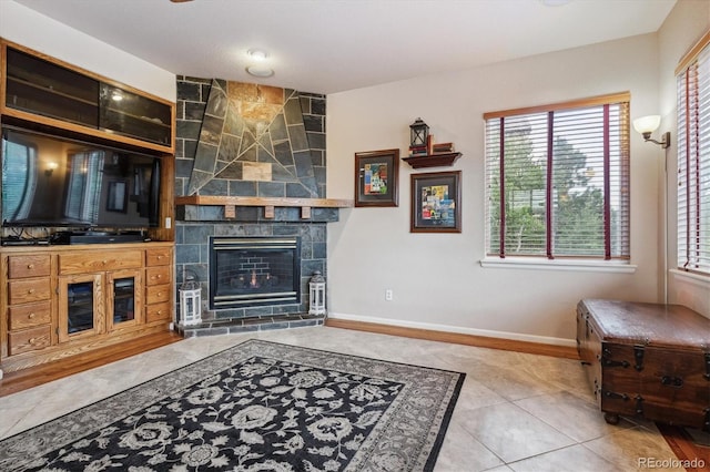 tiled living room with a fireplace