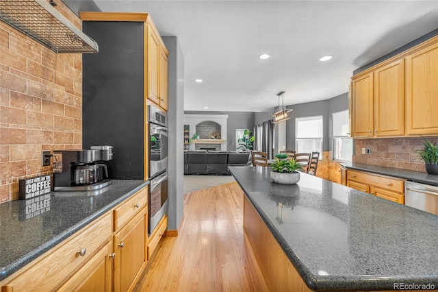 kitchen with tasteful backsplash, light wood-type flooring, and recessed lighting