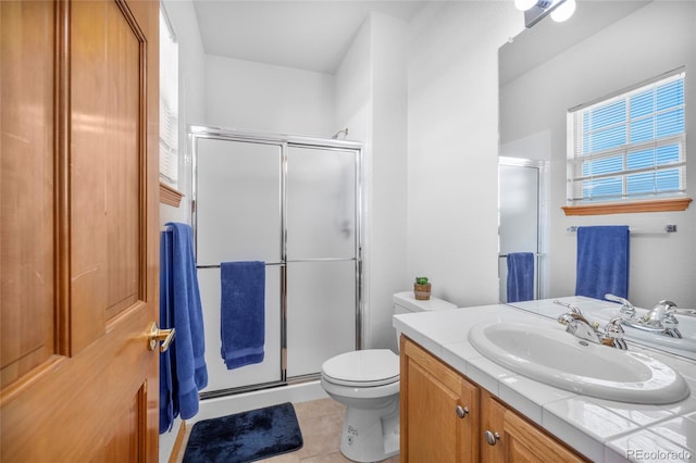 full bath featuring toilet, a stall shower, tile patterned flooring, and vanity