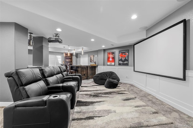 cinema room with recessed lighting, a wainscoted wall, a decorative wall, indoor bar, and carpet