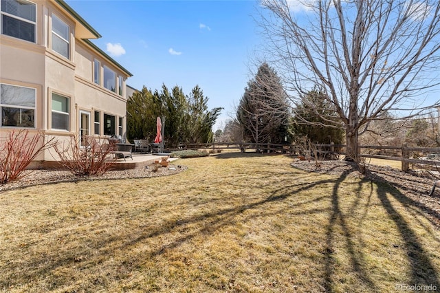 view of yard with a patio area and a fenced backyard