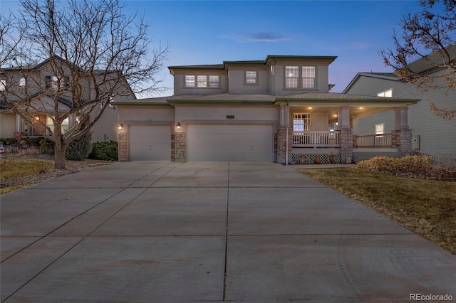 view of front facade featuring stucco siding, a porch, an attached garage, stone siding, and driveway