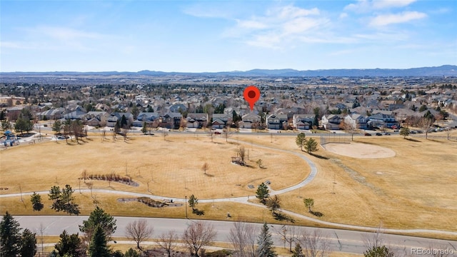 drone / aerial view with a residential view and a mountain view