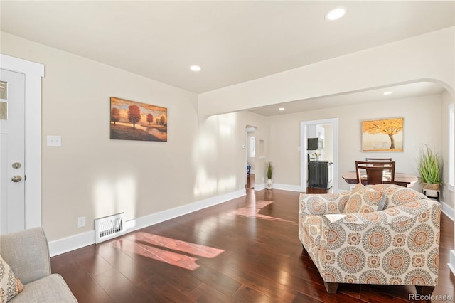 living room with dark wood-type flooring