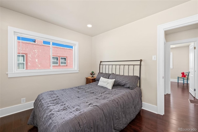 bedroom featuring dark hardwood / wood-style flooring