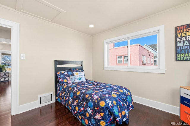 bedroom featuring dark hardwood / wood-style floors and crown molding