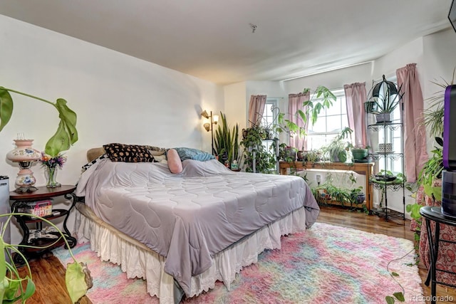 bedroom with wood finished floors