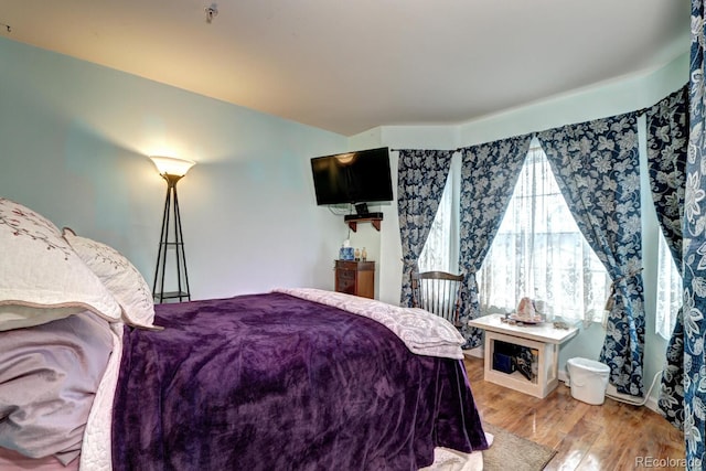 bedroom with wood finished floors