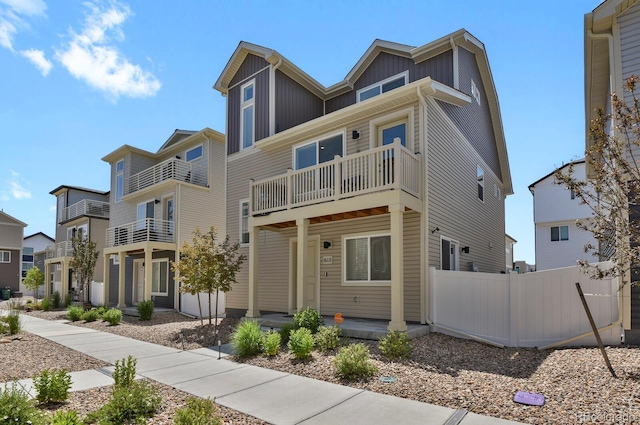 18233 E 51st Ave, Denver, CO 80249 - view of front of home with a balcony and board and batten siding