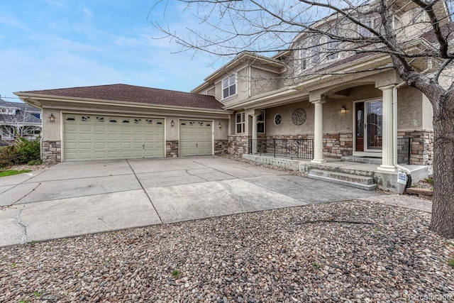 view of front of house with a garage, covered porch, stone siding, stucco siding, and driveway