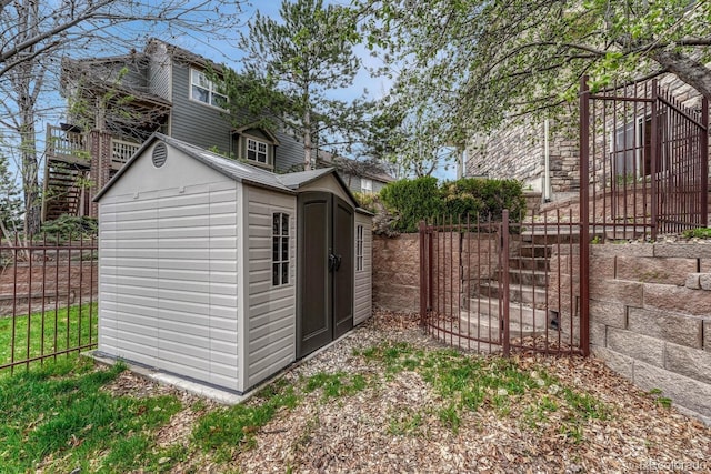 view of shed featuring fence