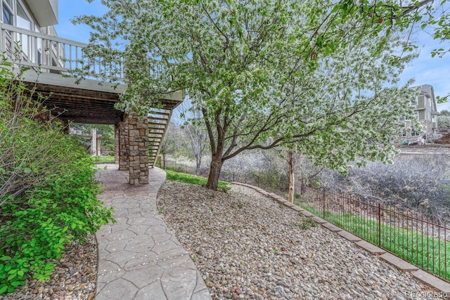 view of yard featuring fence and a patio