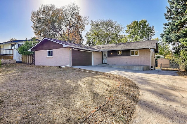 ranch-style home featuring a garage