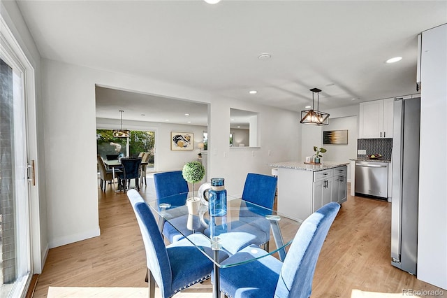 dining room featuring light hardwood / wood-style floors