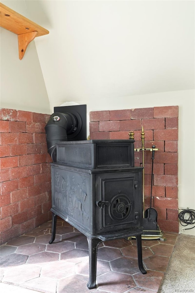 779 High Point Cir, Black Hawk, CO 80422 - detailed view of a wood stove and brick wall