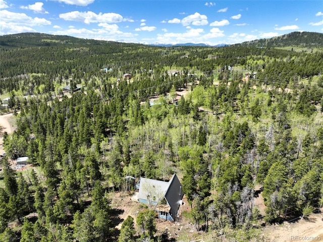 779 High Point Cir, Black Hawk, CO 80422 - aerial view of property and surrounding area featuring a heavily wooded area and a mountain backdrop