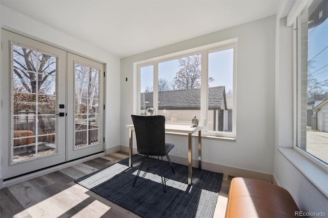 home office with french doors, baseboards, and wood finished floors