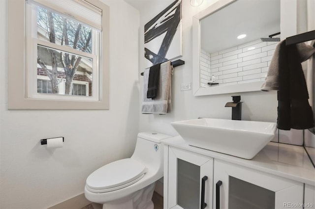 bathroom with vanity and toilet