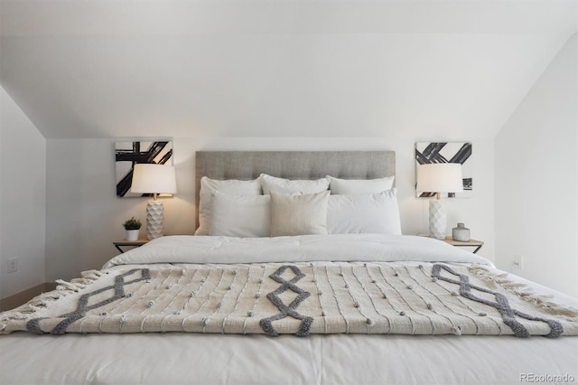 bedroom featuring vaulted ceiling