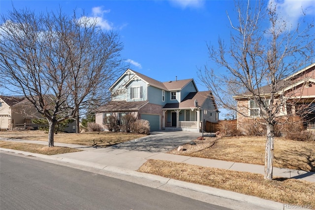 view of front of property with an attached garage, brick siding, and driveway