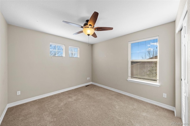 unfurnished bedroom featuring baseboards, ceiling fan, and carpet flooring