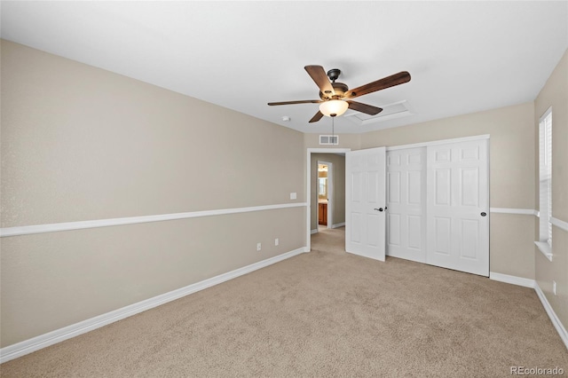 unfurnished bedroom featuring a closet, carpet flooring, ceiling fan, and baseboards