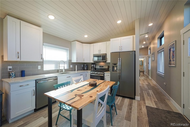 kitchen with white cabinetry, appliances with stainless steel finishes, and sink