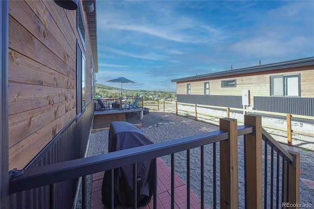 wooden terrace with an outbuilding