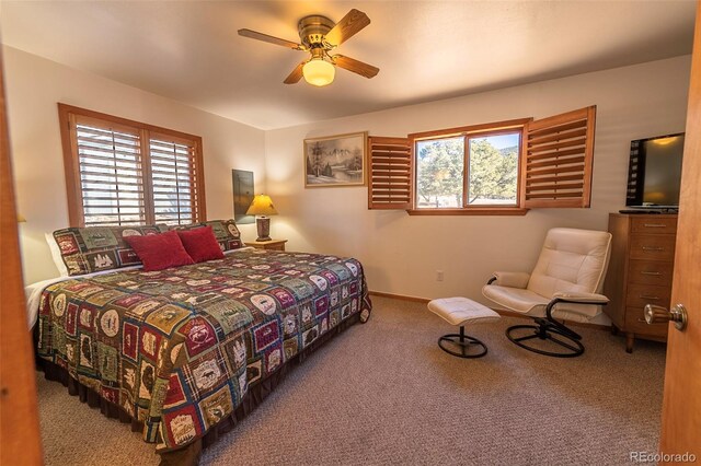 bedroom featuring ceiling fan and carpet floors