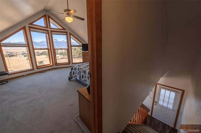 bedroom with multiple windows, high vaulted ceiling, ceiling fan, and carpet floors