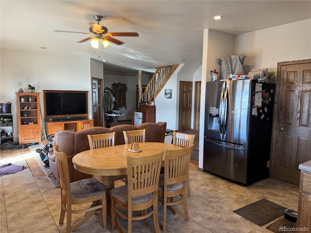 dining space featuring ceiling fan and light tile patterned floors