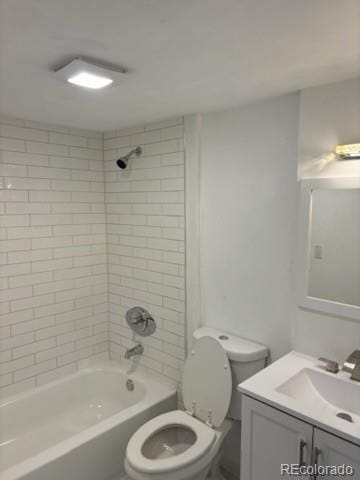 full bathroom with vanity, washtub / shower combination, and toilet