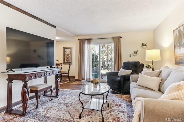 2375 S Linden Ct Unit 118, Denver, CO 80222 - living room featuring a textured ceiling and wood finished floors