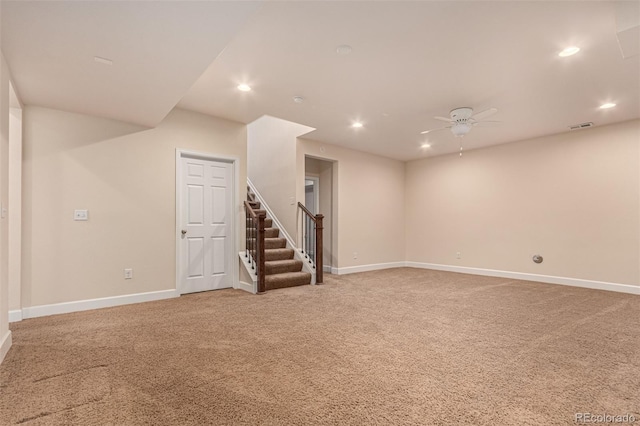 spare room featuring light carpet, baseboards, visible vents, and recessed lighting