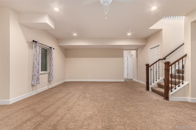 carpeted spare room featuring recessed lighting, ceiling fan, stairway, and baseboards