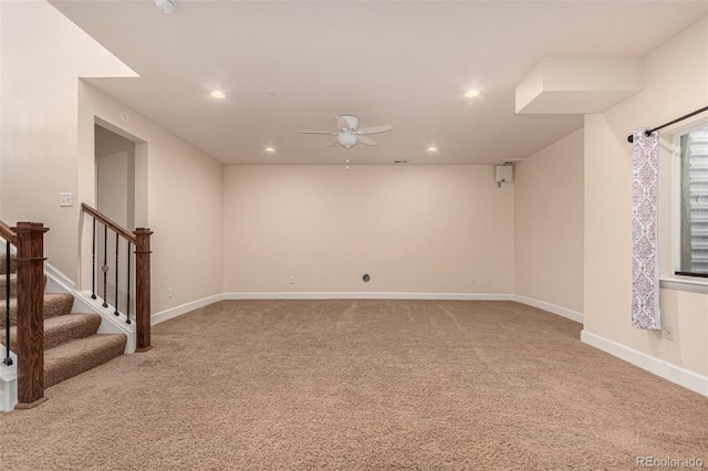 basement with carpet, recessed lighting, stairway, a ceiling fan, and baseboards