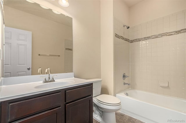 bathroom featuring shower / bath combination, vanity, and toilet