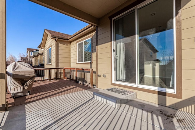 wooden deck with area for grilling