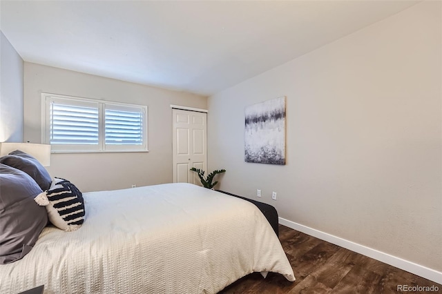 bedroom featuring a closet and dark hardwood / wood-style flooring