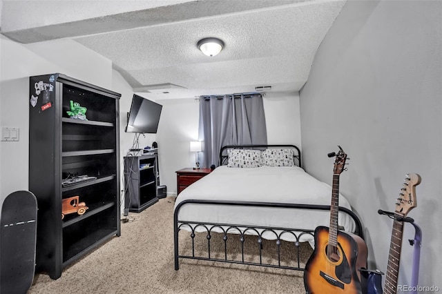 carpeted bedroom with visible vents and a textured ceiling